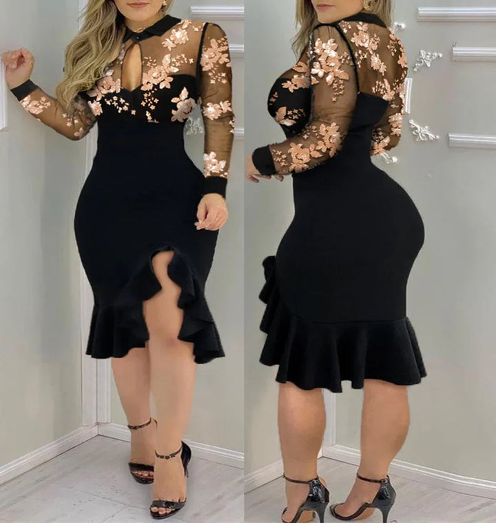 Woman wearing black bodycon dress with sheer floral embroidered top and ruffled hem in studio