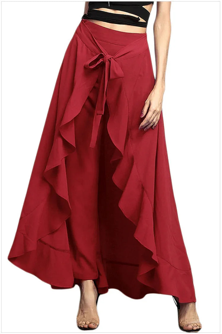 Woman wearing stylish red layered ruffle wrap palazzo pants with front tie detail