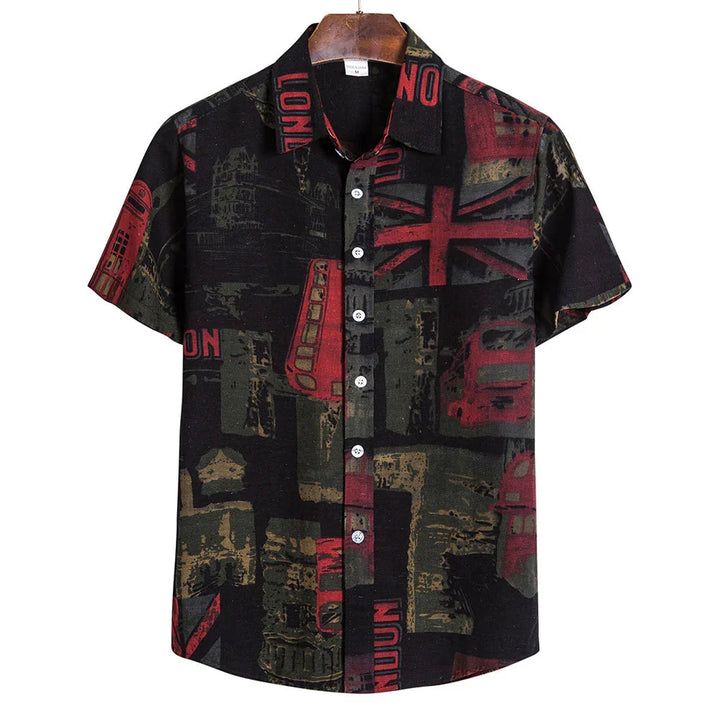 Black short-sleeve button-up shirt with red and green London-themed prints including double-decker buses and Union Jack