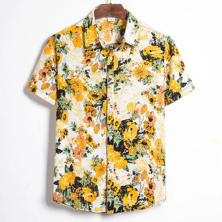 Men's short sleeve button-up shirt with vibrant yellow and orange floral print on white background