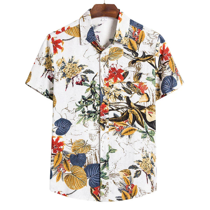White short-sleeve Hawaiian shirt with colorful tropical floral and leaf pattern