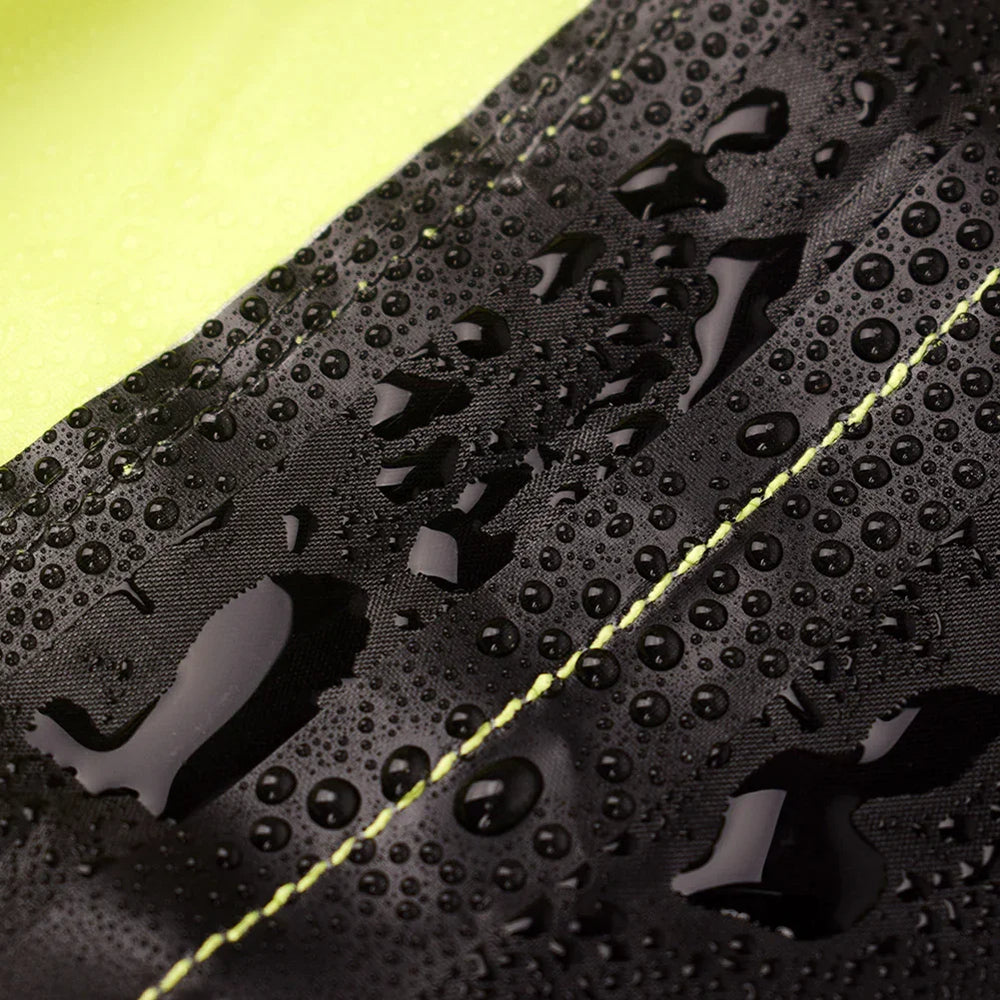 Water droplets on black waterproof fabric with yellow stitching, close-up