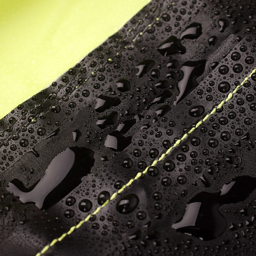 Water droplets on black waterproof fabric with yellow stitching, close-up