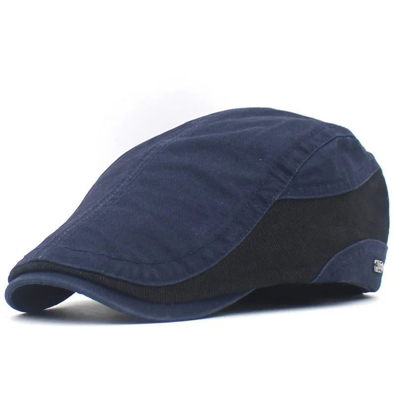 Stylish navy blue and black flat cap with curved brim on white background