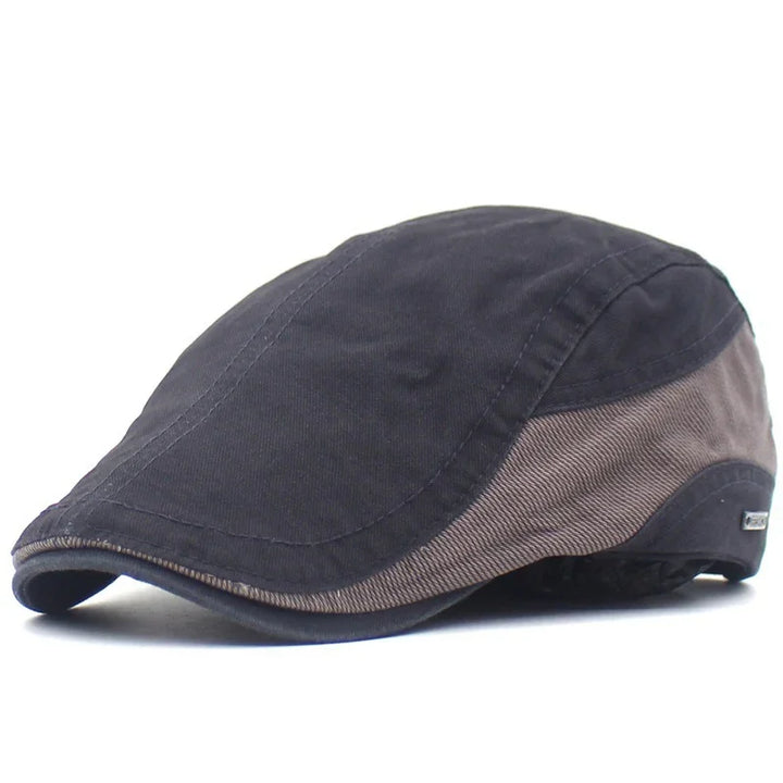 Men's two-tone black and brown flat cap with stitched detailing and small side metal tag