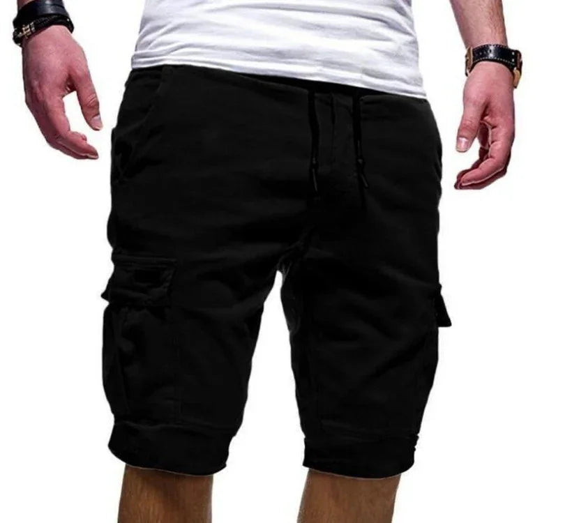 Man wearing black cargo shorts with drawstring and white t-shirt, casual summer outfit