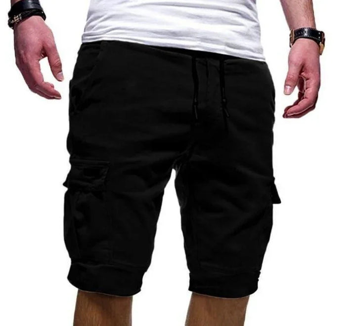 Man wearing black cargo shorts with drawstring and white t-shirt, casual summer outfit