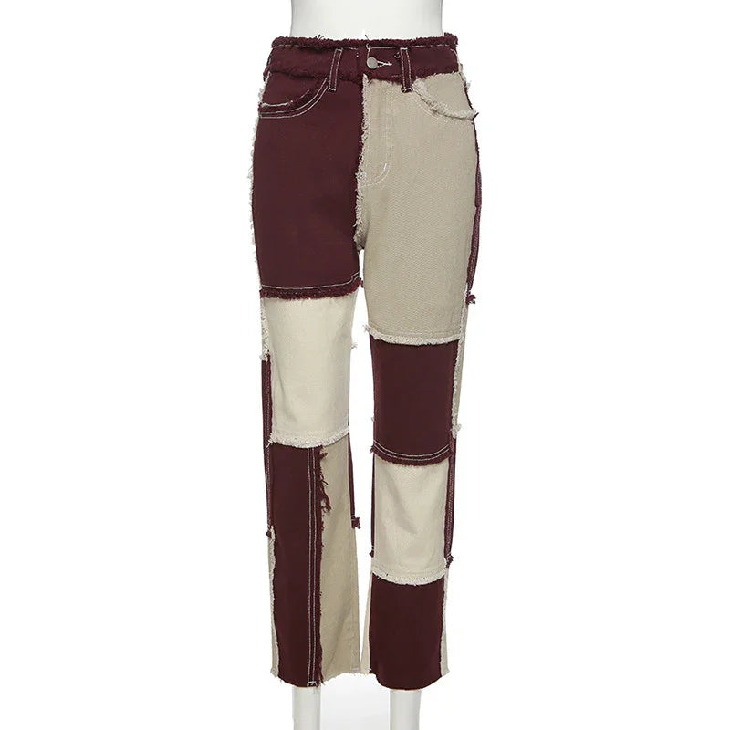 Two-tone patchwork pants in burgundy and beige with raw edges and contrasting stitching
