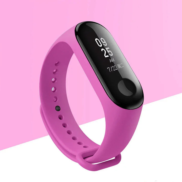 Pink fitness tracker with black display showing time and date on pink and white background