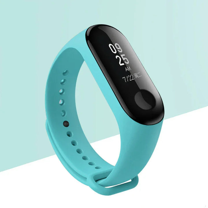 Blue fitness tracker smart band with black touchscreen displaying time and date on light blue background