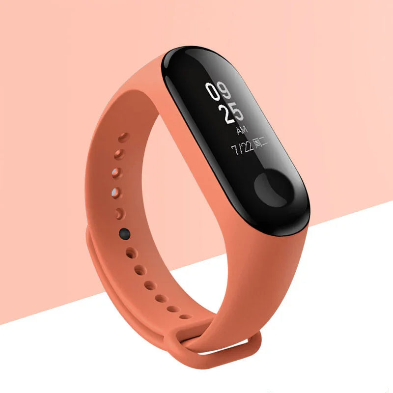 Orange fitness tracker wristband with black screen displaying time 09:25 AM and date 7/22