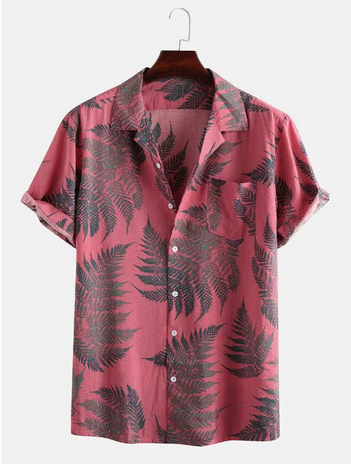 Pink short-sleeve button-up shirt with black fern leaf pattern on wooden hanger