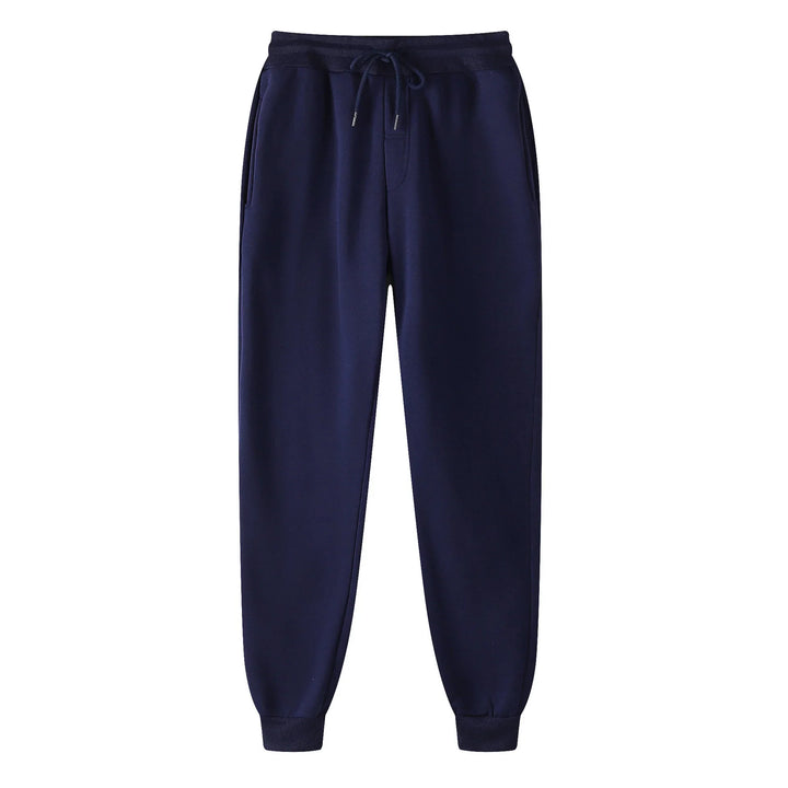 Navy blue jogger sweatpants with drawstring waist and cuffed ankles on white background