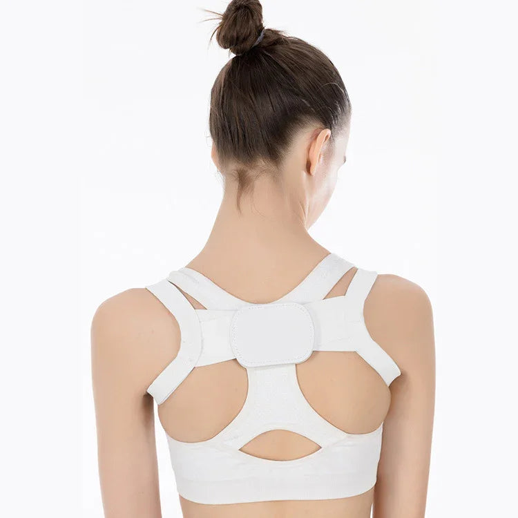 Woman wearing white posture corrector brace on upper back with adjustable straps