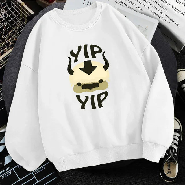 White sweatshirt featuring cartoon pug face design with text 'YIP YIP' in bold letters