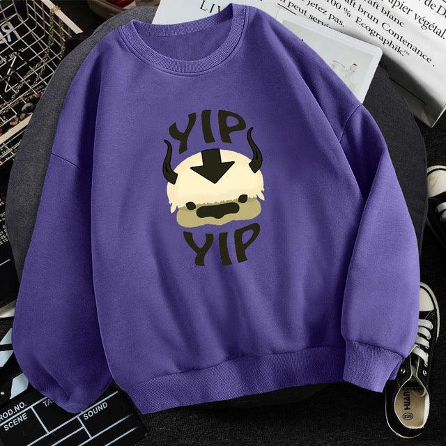 Purple sweatshirt with cartoon Appa face and 'Yip Yip' text design