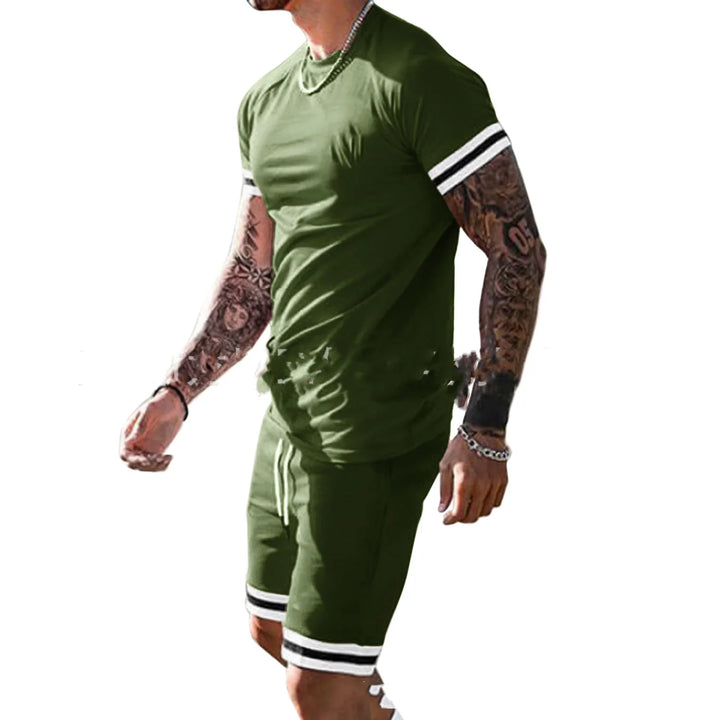 Man wearing green casual shorts and t-shirt set with white and black stripes on sleeves and shorts