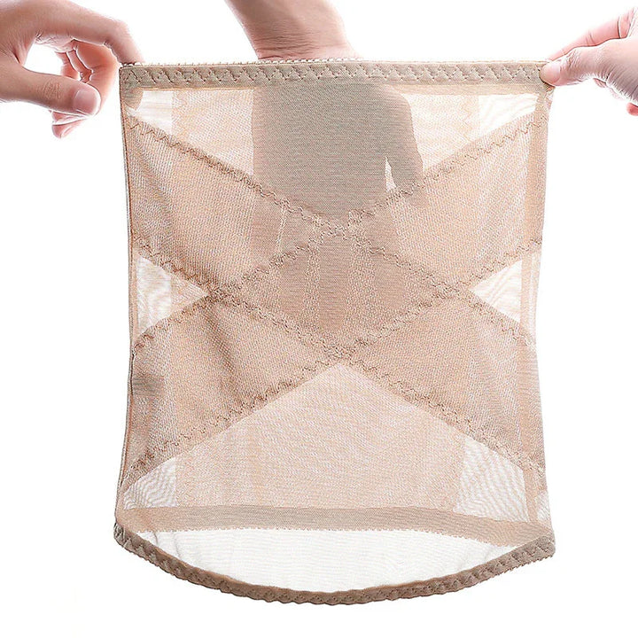 Hands stretching beige sheer mesh shapewear with reinforced cross stitching