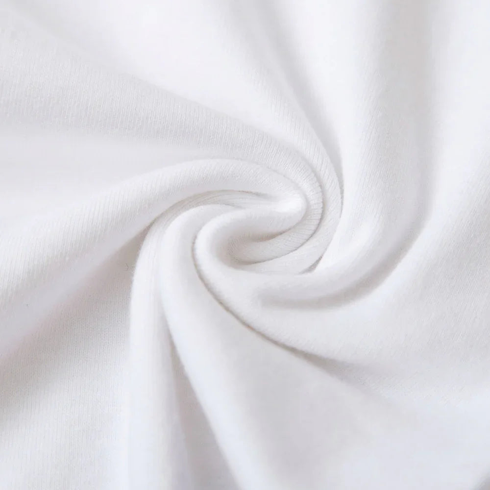 Close-up of soft white cotton fabric with spiral fold texture