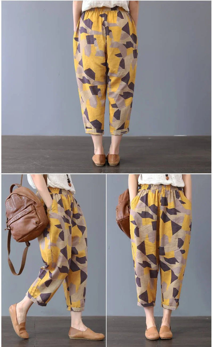 Woman wearing loose fit yellow and brown geometric print casual cropped pants with elastic waist and tan flats