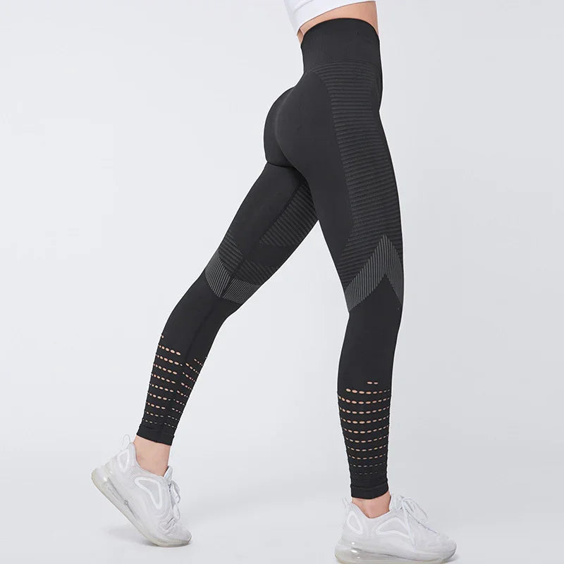 Woman wearing black high-waisted seamless leggings with textured patterns and white sneakers