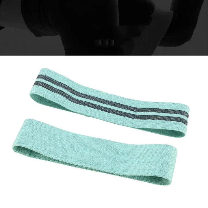 Light blue fabric resistance bands with black stripes for fitness and exercise