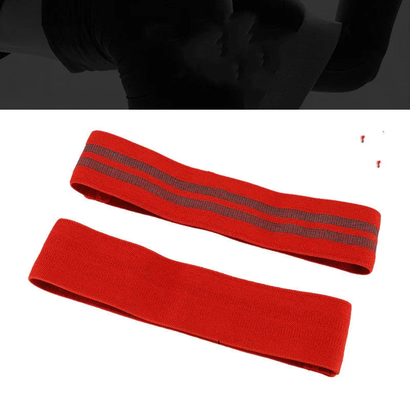 Red resistance bands for fitness and strength training on white background