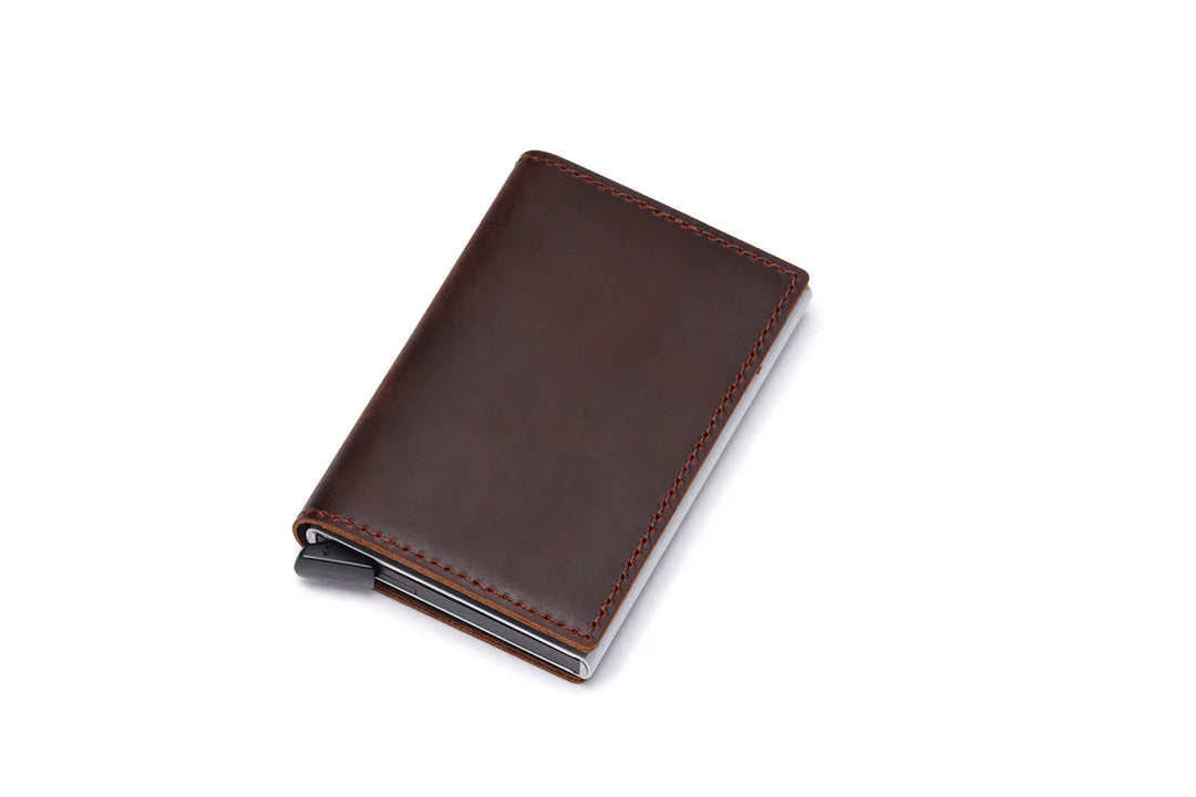 Compact dark brown leather wallet with red stitching, sleek and minimalist design