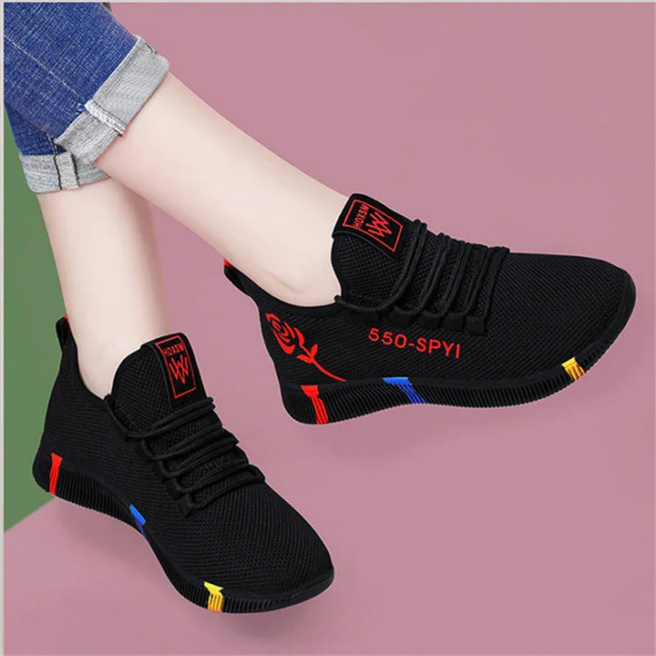 Black breathable knit sneakers with red rose design, 550-SPYI text, and colorful sole accents