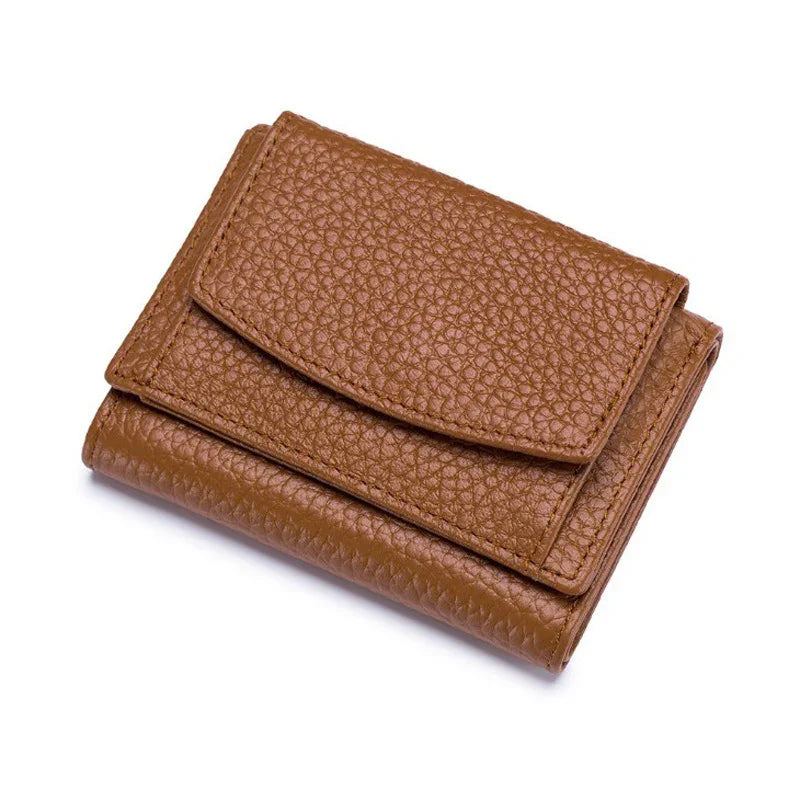 Brown textured leather wallet with flap closure on white background