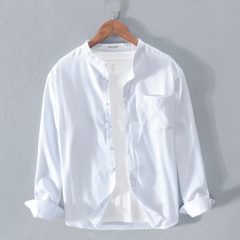 White casual long-sleeve button-up shirt with mandarin collar on wooden hanger