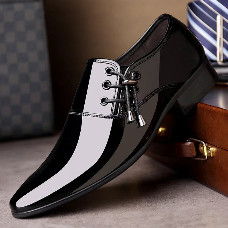 sleek black patent leather dress shoe with pointed toe and lace-up design on brown surface