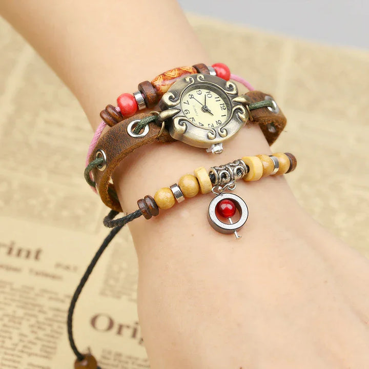 Vintage-style wristwatch with decorative leather and beaded bracelets featuring red and wooden beads