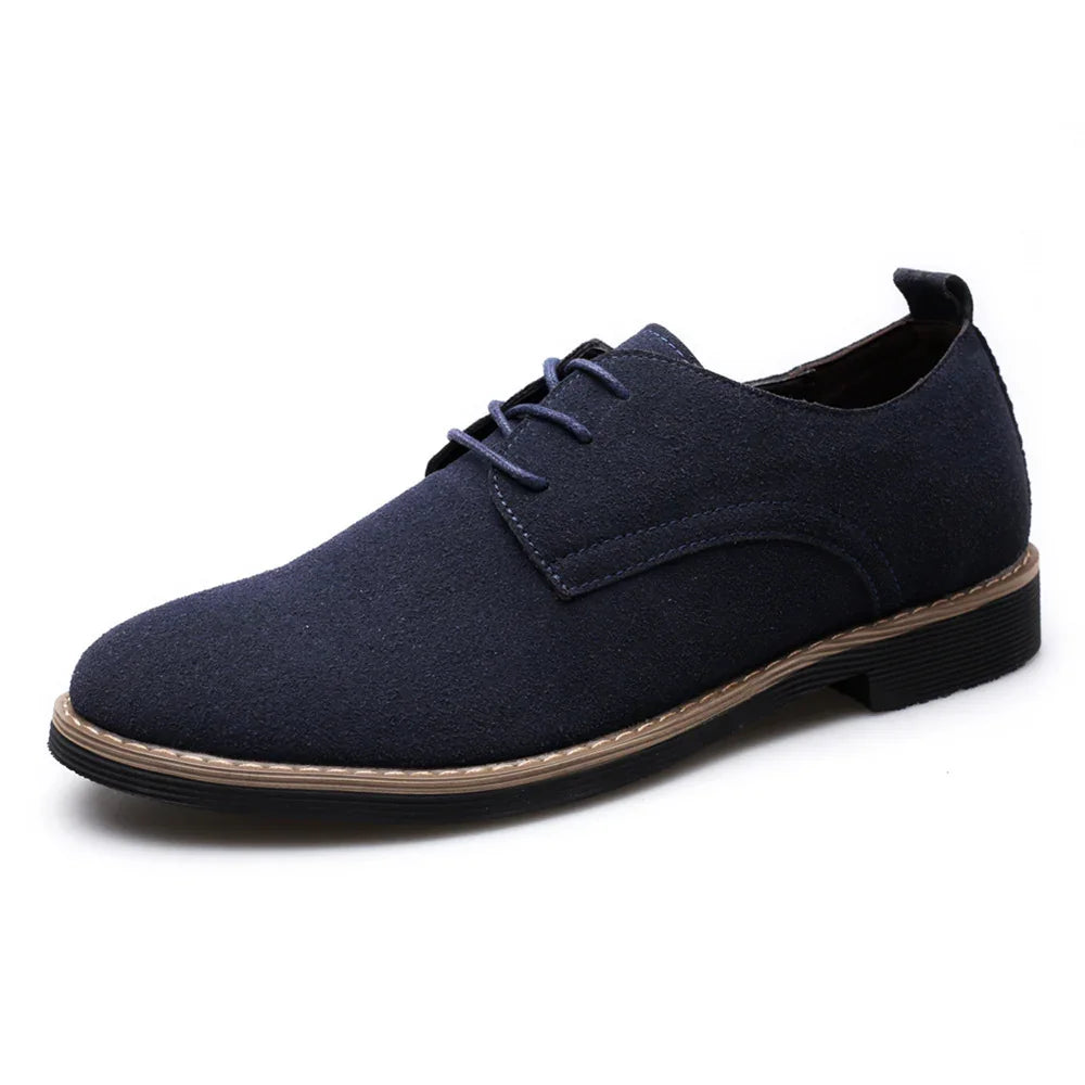 Men's navy blue suede lace-up dress shoe with black sole and brown stitching detail