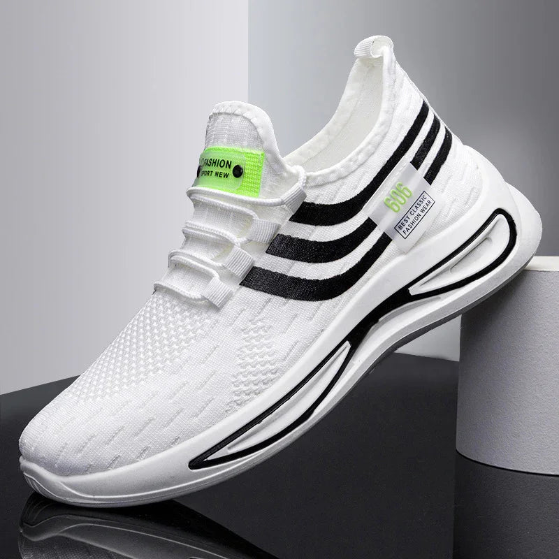White knit sports sneaker with black stripes and neon green labels on a reflective surface