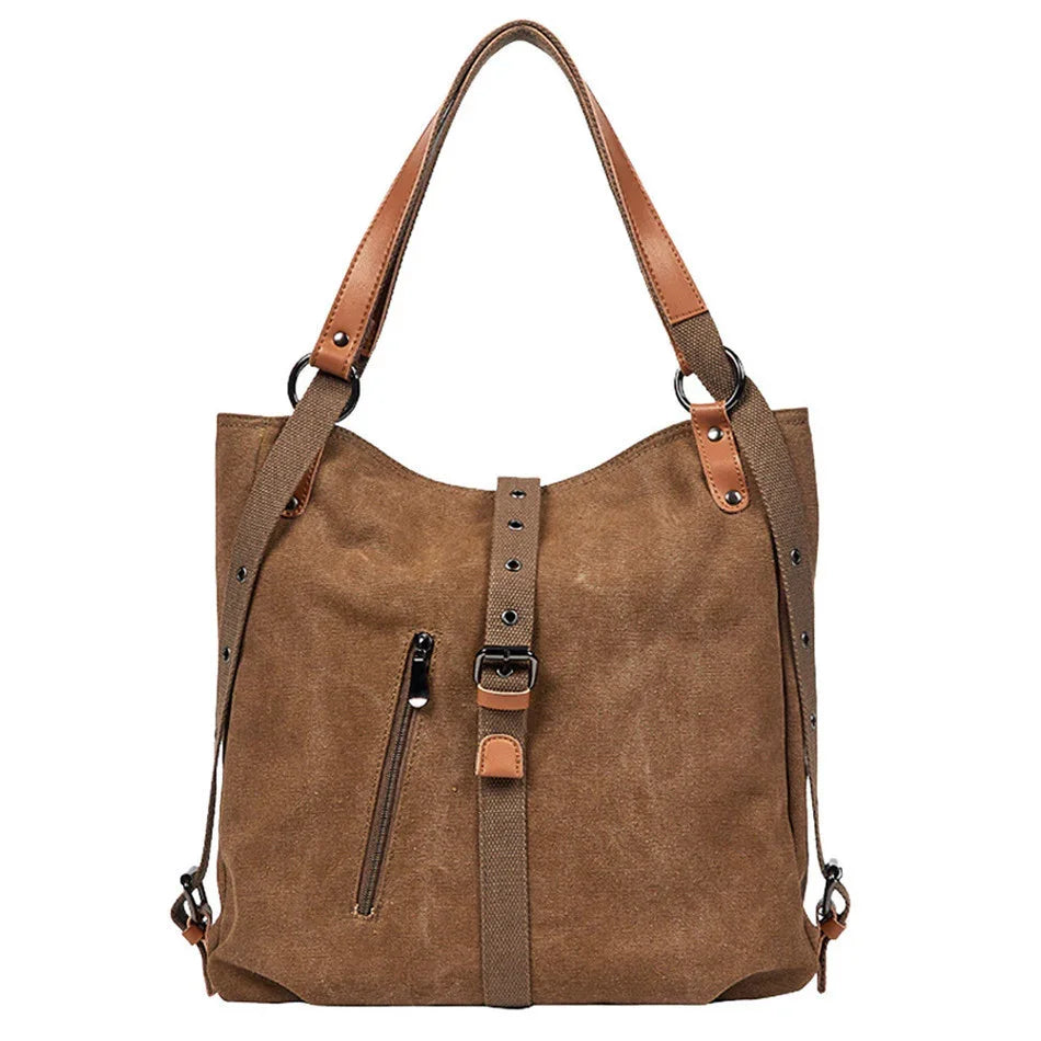 brown suede tote bag with adjustable straps and front zipper pocket