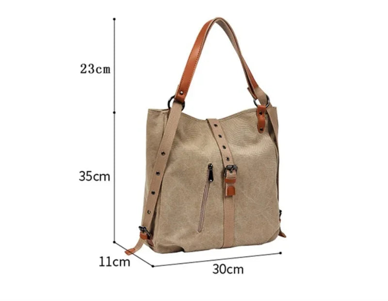 Beige leather shoulder bag with brown straps, front zipper pocket, and buckle detail, dimensions shown