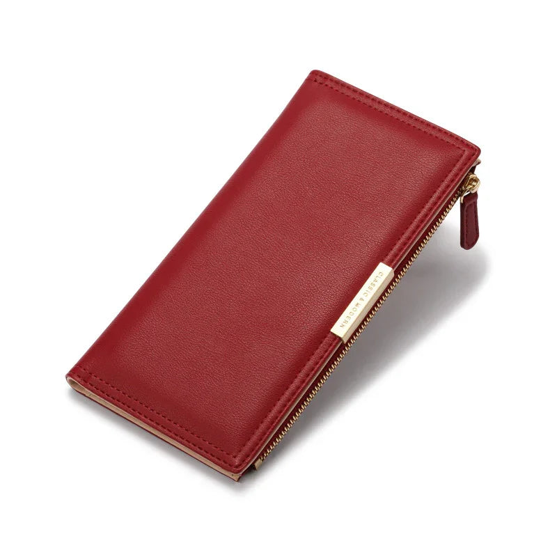 Elegant red leather wallet with gold zipper and minimalist design on white background