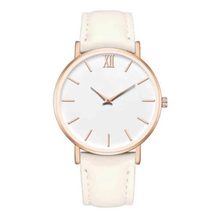 Minimalist wristwatch with white face, rose gold case, and cream leather strap
