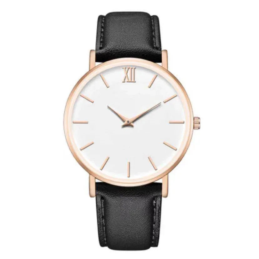 Minimalist wristwatch with rose gold case, white dial, black leather strap, and Roman numeral XII