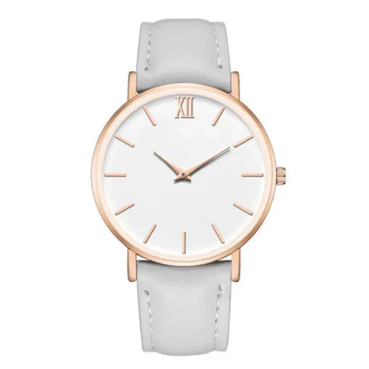 Minimalist round white wristwatch with rose gold case and white leather strap