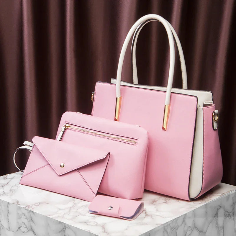 Set of elegant pink faux leather handbags and accessories on marble surface with brown curtain background