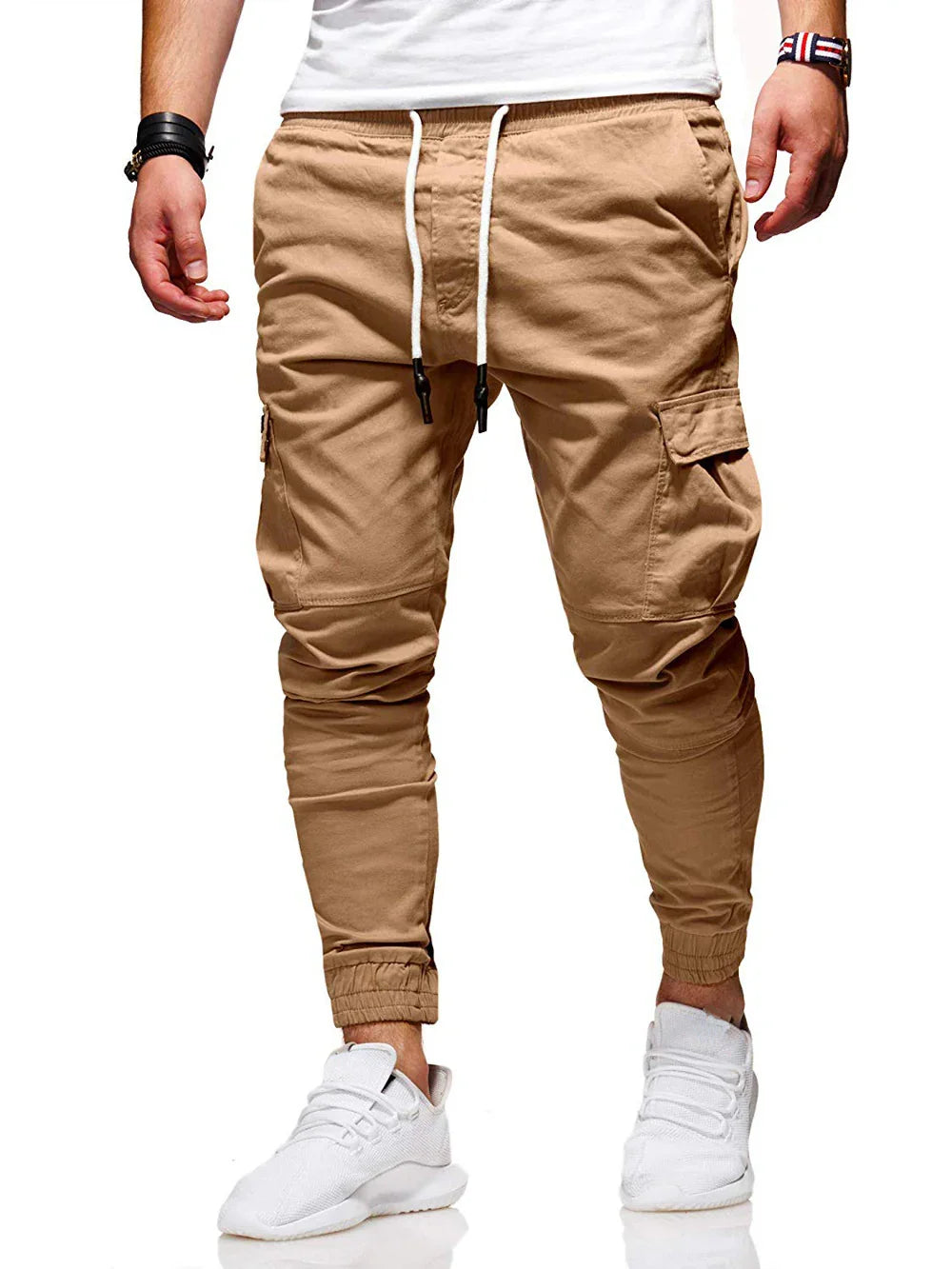 Men's khaki cargo jogger pants with drawstring waist and tapered elastic cuffs styled with white sneakers