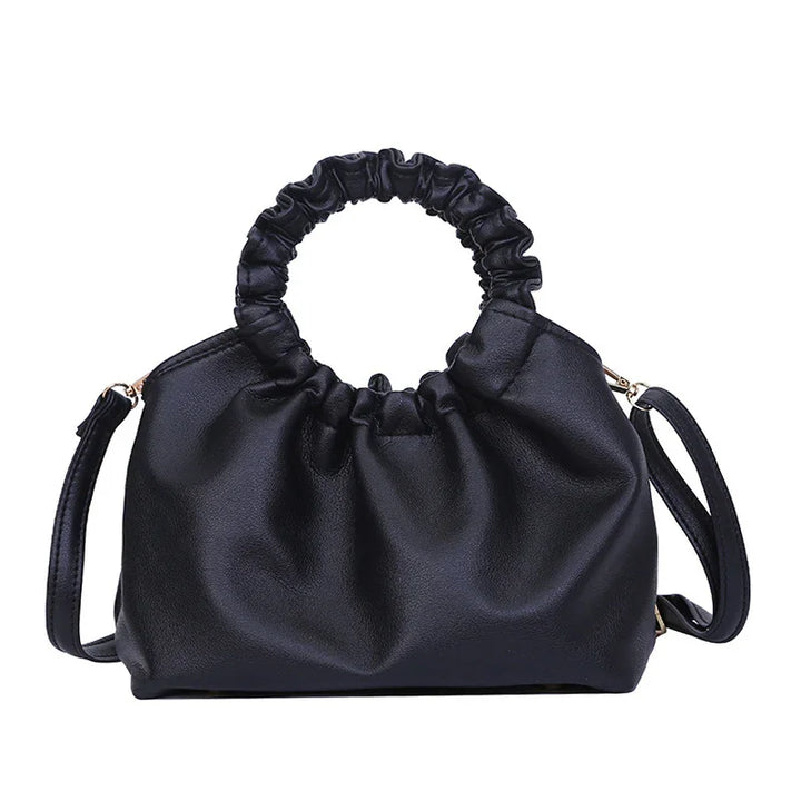 Black ruched leather handbag with round scrunched handle and detachable shoulder strap