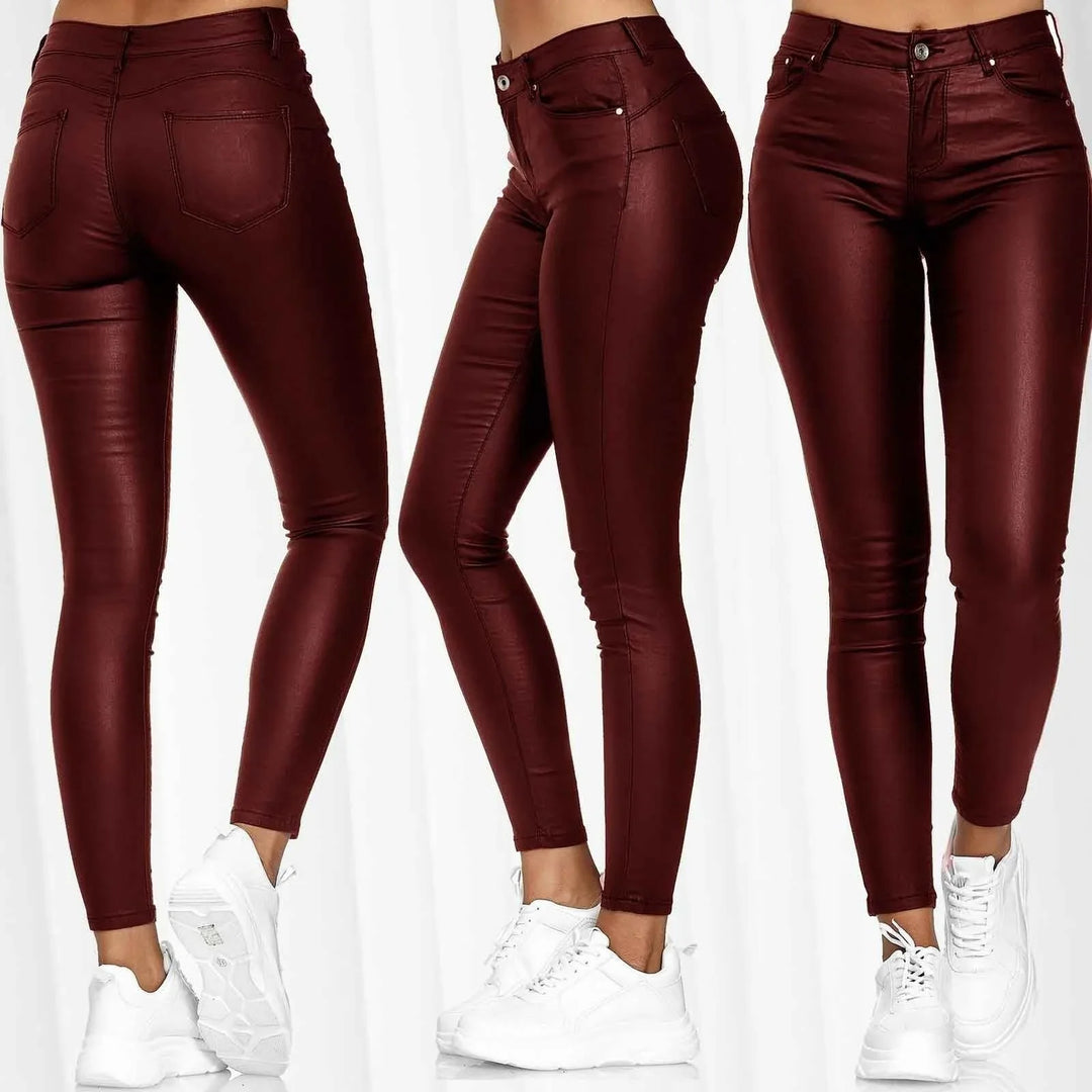 Women wearing high-waist burgundy coated skinny jeans with white sneakers, front and back views