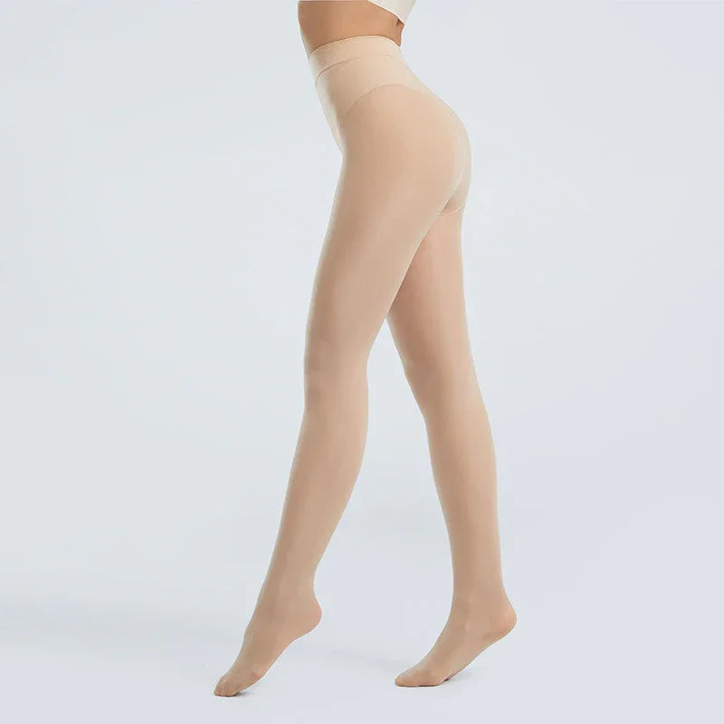 Female legs wearing nude seamless high-waisted tights on a light gray background