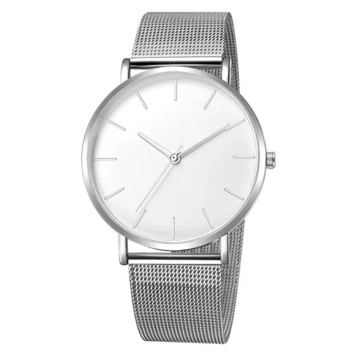 Minimalist silver wristwatch with mesh band and white dial on white background