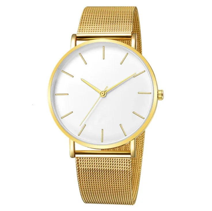 Minimalist gold wristwatch with mesh band and white dial featuring gold hour markers