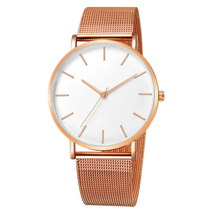 Minimalist rose gold wristwatch with white dial and mesh strap