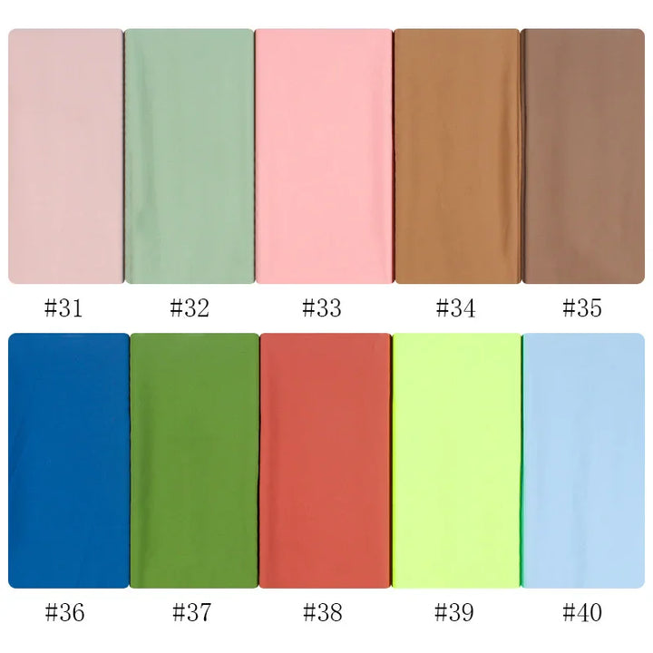 Fabric swatches in pastel and vibrant colors numbered 31 to 40, including pink, green, brown, blue, and yellow